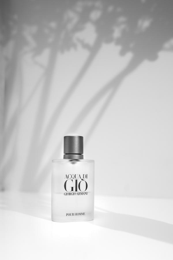 Acqua di Giò by Giorgio Armani perfume bottle on gray background by Austin Wilcox