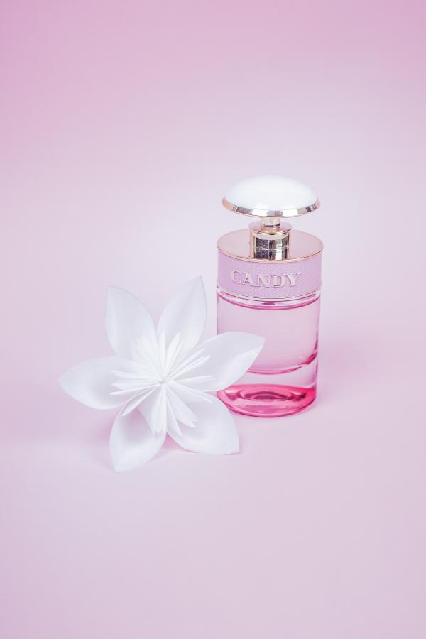 Prada Candy perfume bottle with pink background by Dario Gomes.